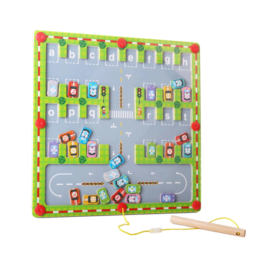 Angled view of the wooden alphabet parking maze with colorful car pieces and a magnetic pen