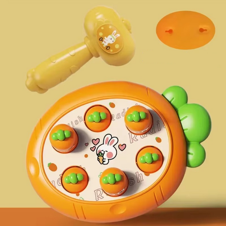 Orange carrot-target tapping board with a yellow hammer and a separate round orange panel