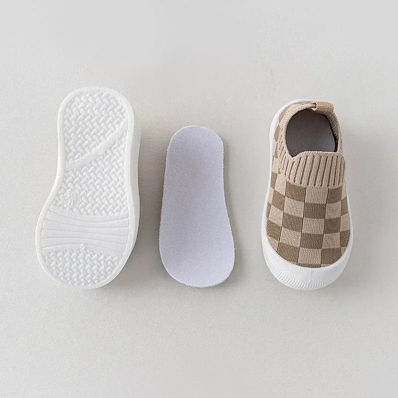Textured white sole, separate insole, and brown-beige checkered slip-on shoe shown side by side
