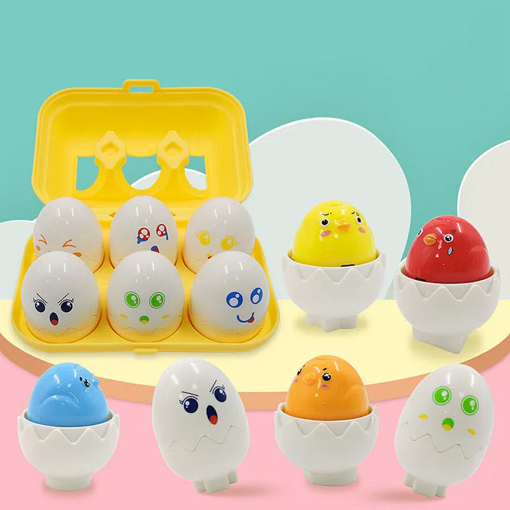 Open and closed chick puzzle eggs arranged beside a yellow carton-style storage case