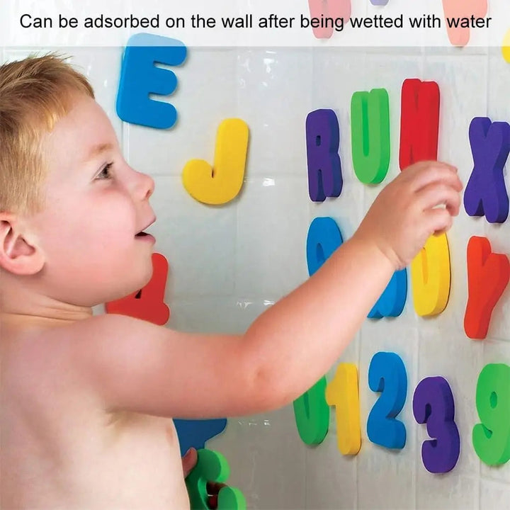 Child placing colorful bath letters on a tile wall