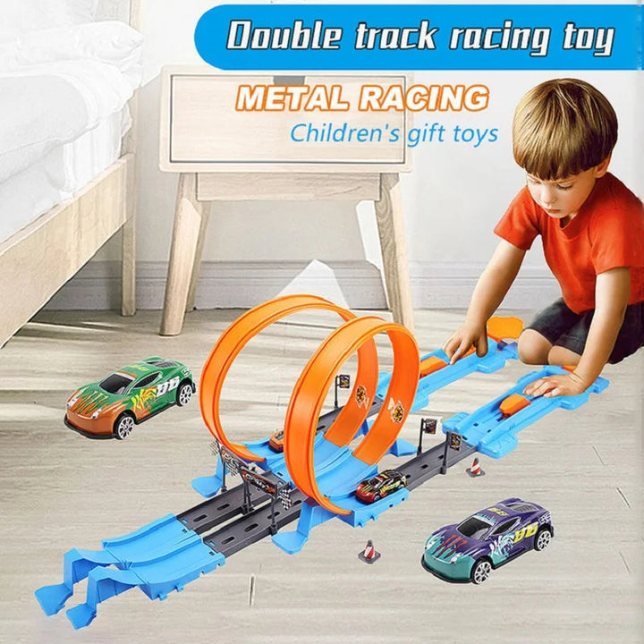 Child playing with an orange-loop race track and blue launchers on the floor.