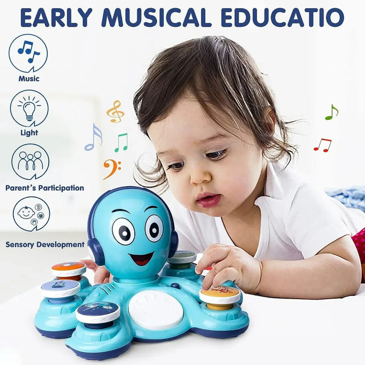 Child pressing a musical insert on a blue octopus music toy.