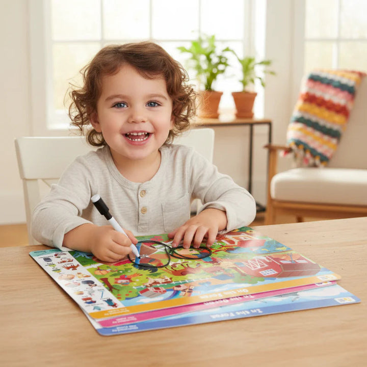 Child using a pen on a colorful search-and-find activity book at a table