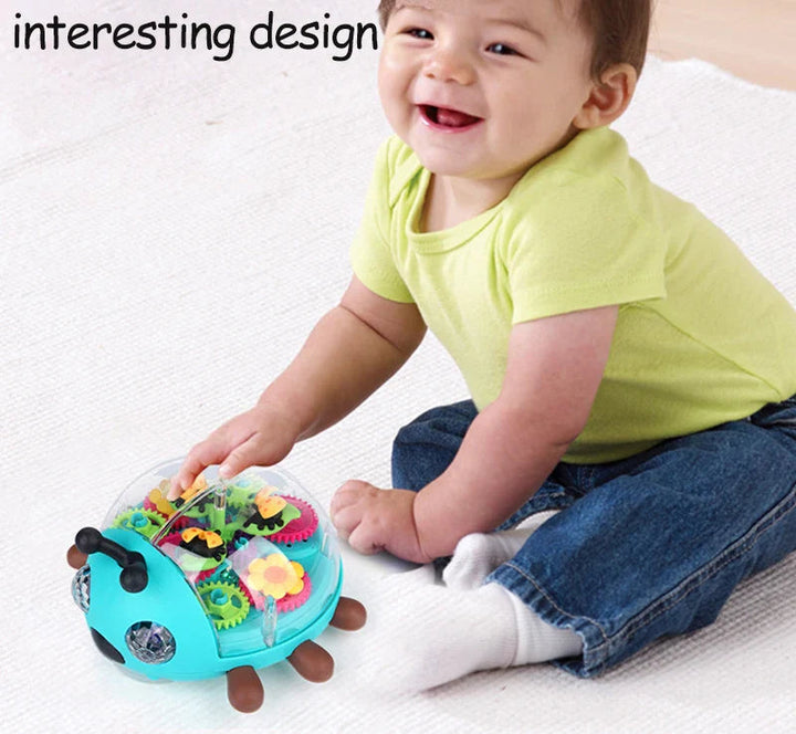 Smiling child sitting beside a turquoise beetle toy with colorful gears