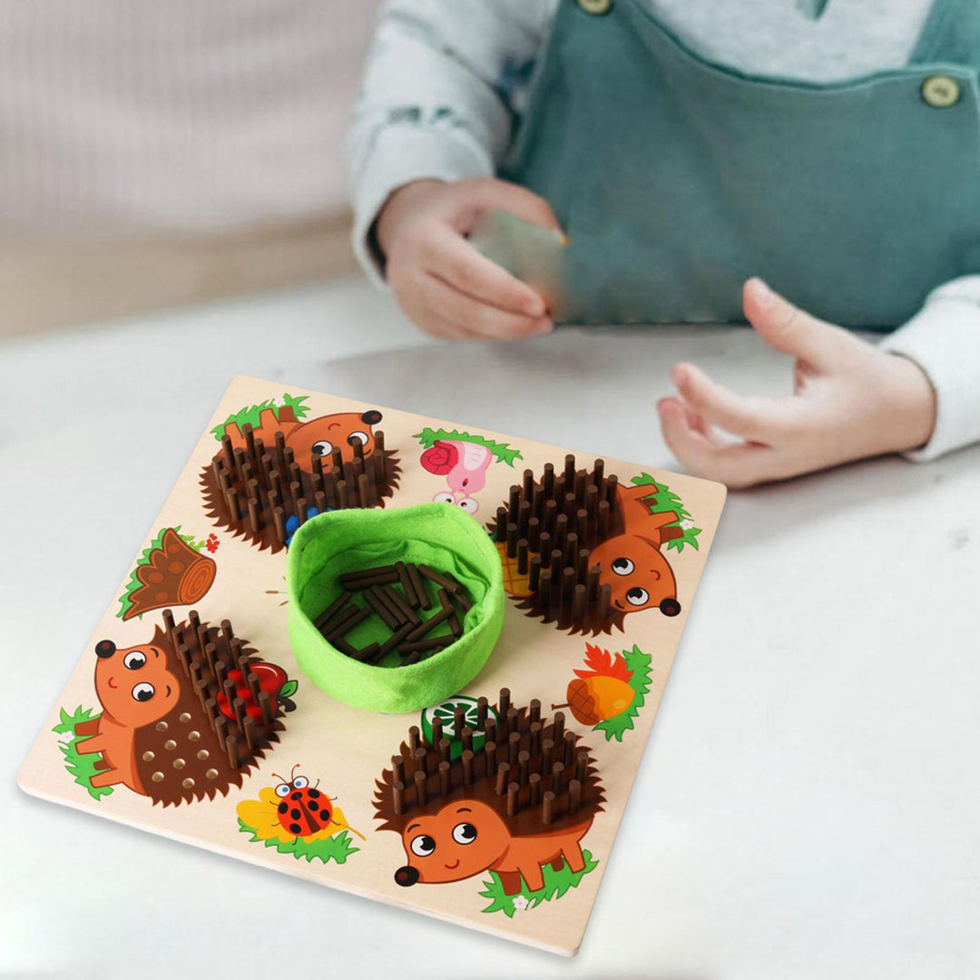 Child playing with a wooden hedgehog counting board at a table