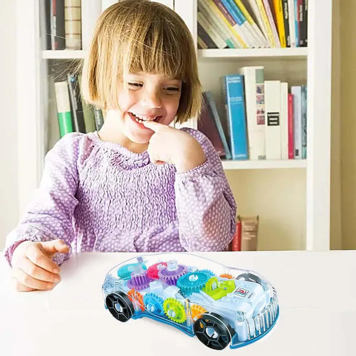 Child watching a transparent gear toy racing car on a white table