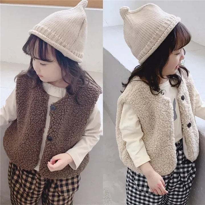 Side-by-side views of a child wearing brown and light-colored plush vests over long-sleeve tops