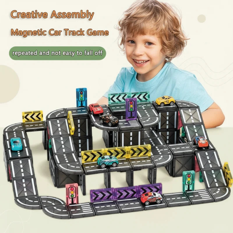 Child beside a multilevel magnetic road layout with toy cars and colorful traffic signs