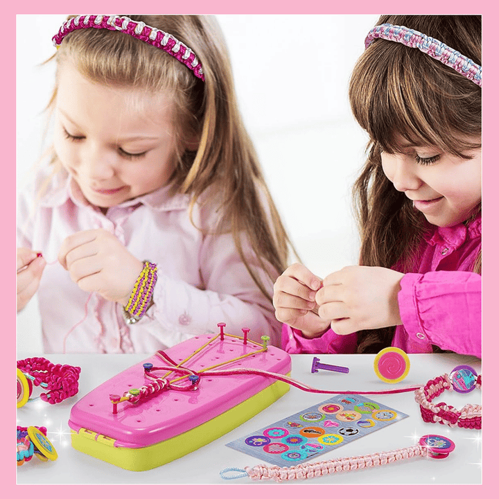 Two children making colorful jewelry together at a craft table