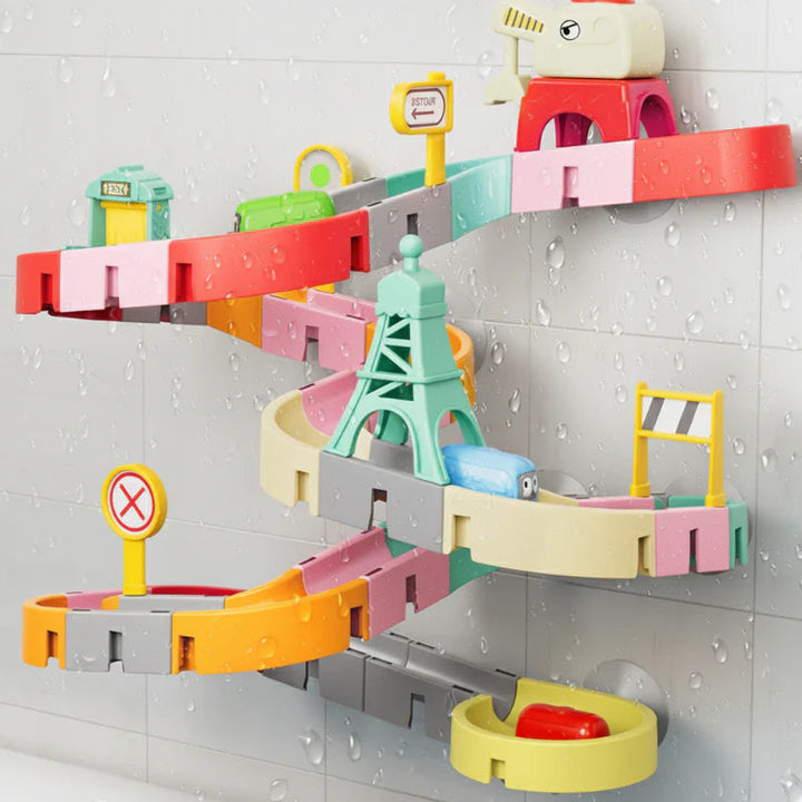 City bath toy track with colorful slide sections, road signs, and suction-cup mounts