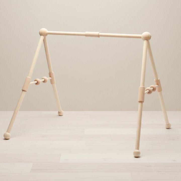 Classical wooden baby gym frame with a straight crossbar and angled legs.