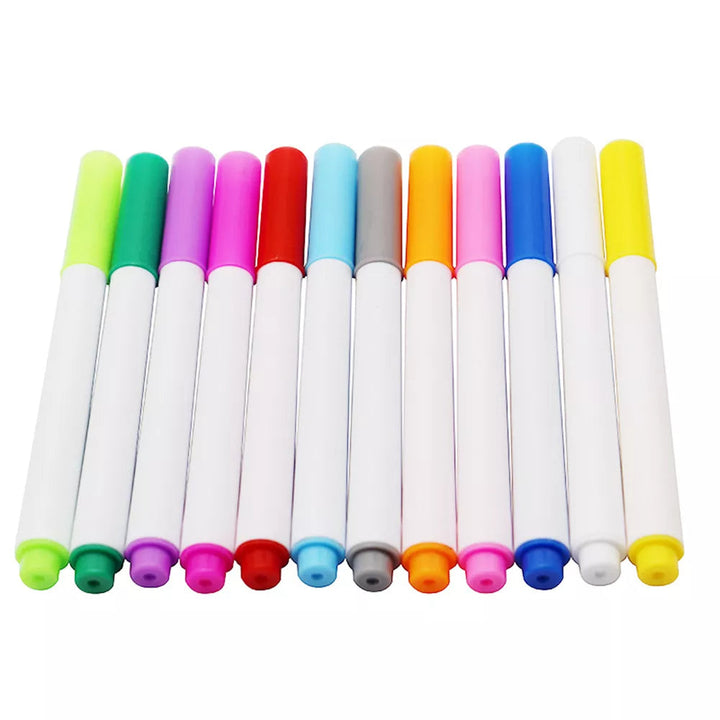 White-barrel drawing pens with assorted colored caps arranged side by side