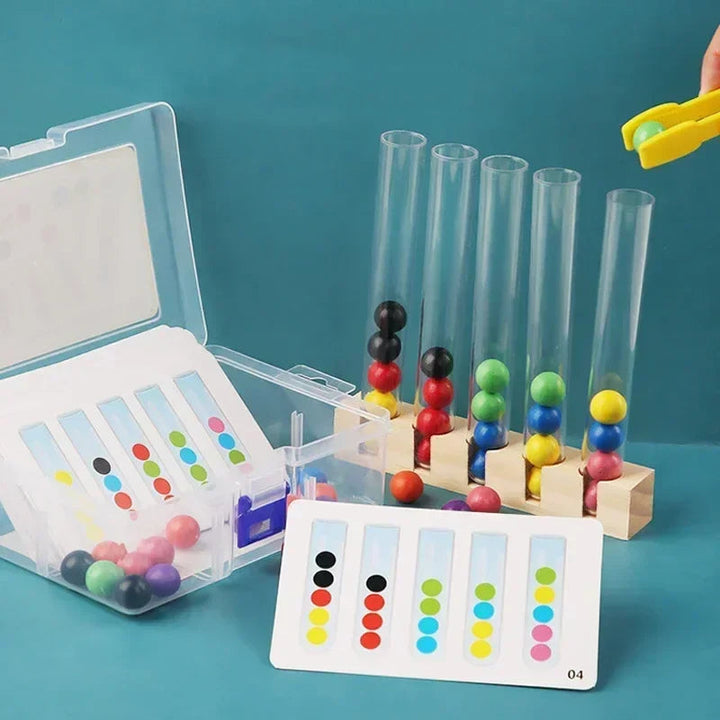 Color-matching game with five clear tubes, wooden balls, pattern cards and a storage box