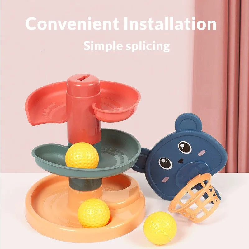 Stackable red, green, and orange ball-drop tracks beside a blue bear topper and yellow balls