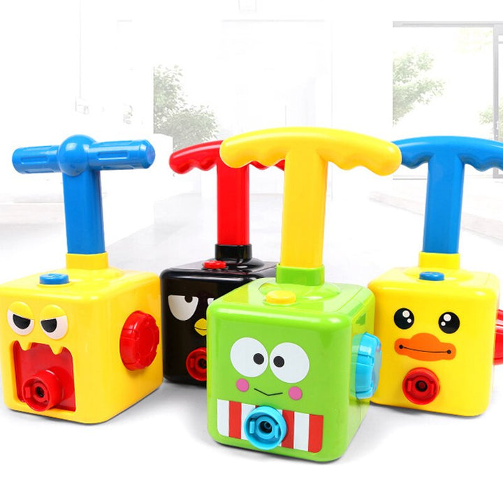 Green, yellow and black balloon-car pumps with colorful handles and face designs