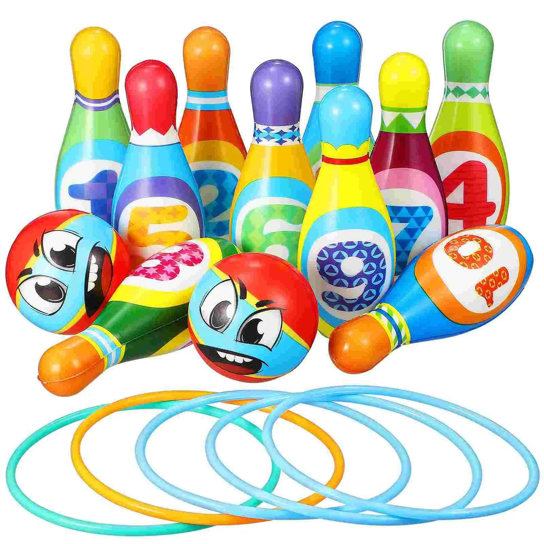 Colorful numbered bowling pins, two cartoon-face bowling balls, and five rings