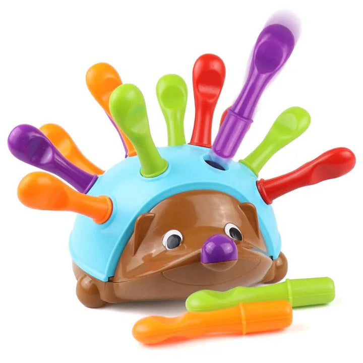 Blue and brown hedgehog toy with colorful removable quills and two loose pieces