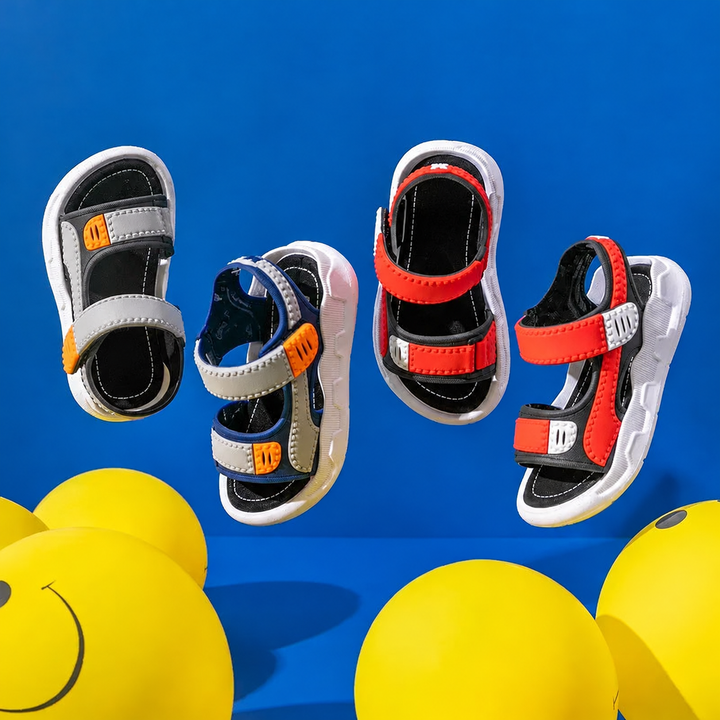 Assorted gray, blue, and red sandals displayed against blue with yellow balloons