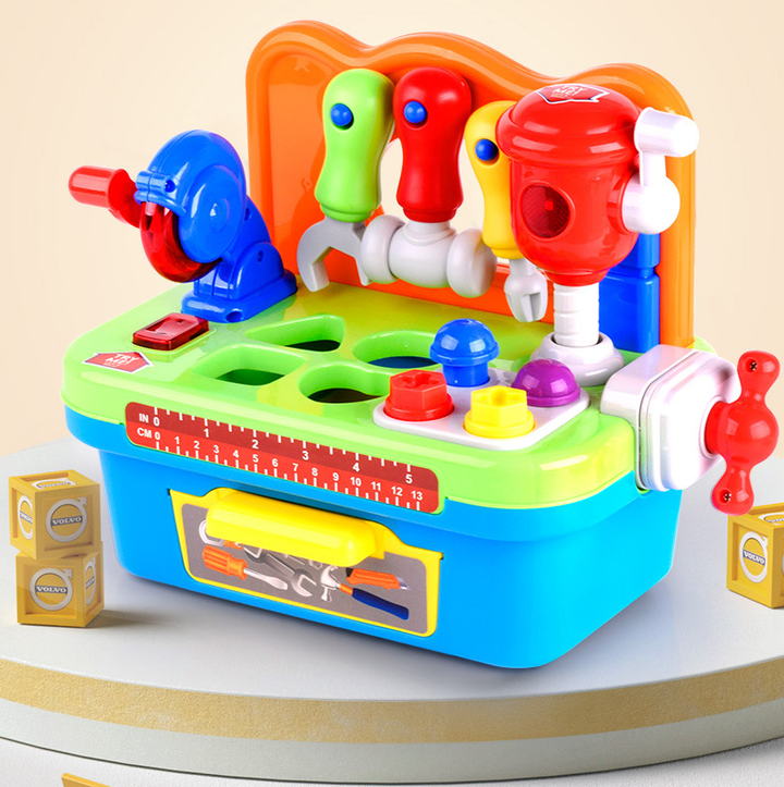 Colorful toy workbench with hanging pretend tools, sorting openings, and a blue storage base