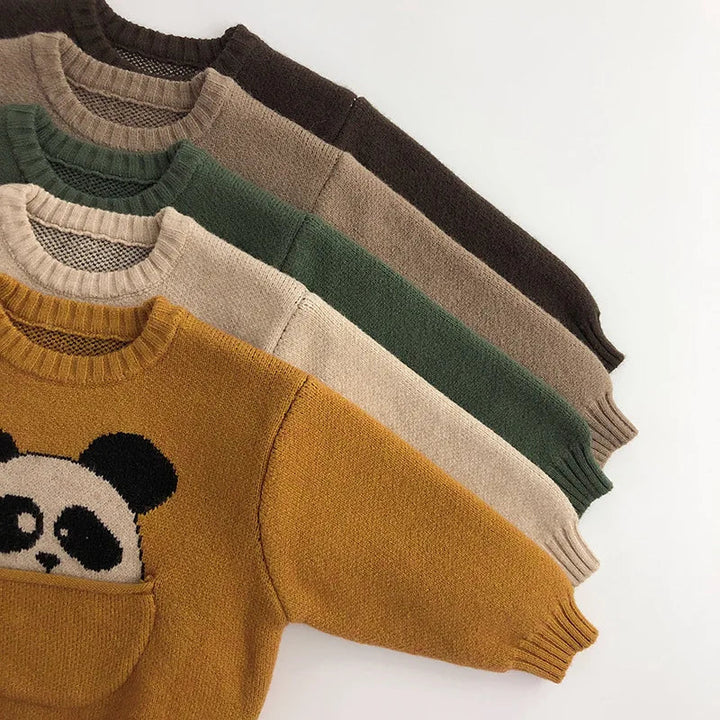 Five animal knit sweaters layered to show color options, long sleeves, and ribbed cuffs