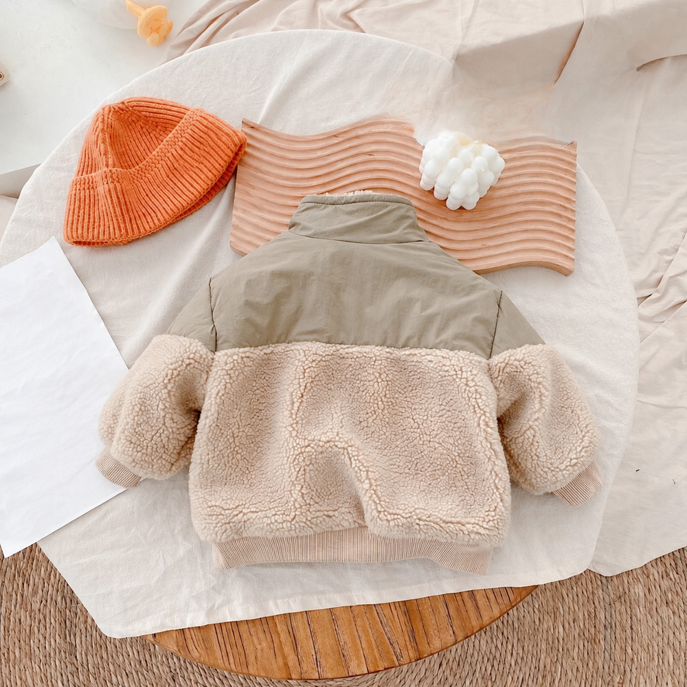 Back of two-tone kids' jacket with a khaki upper panel and beige fleece body and sleeves