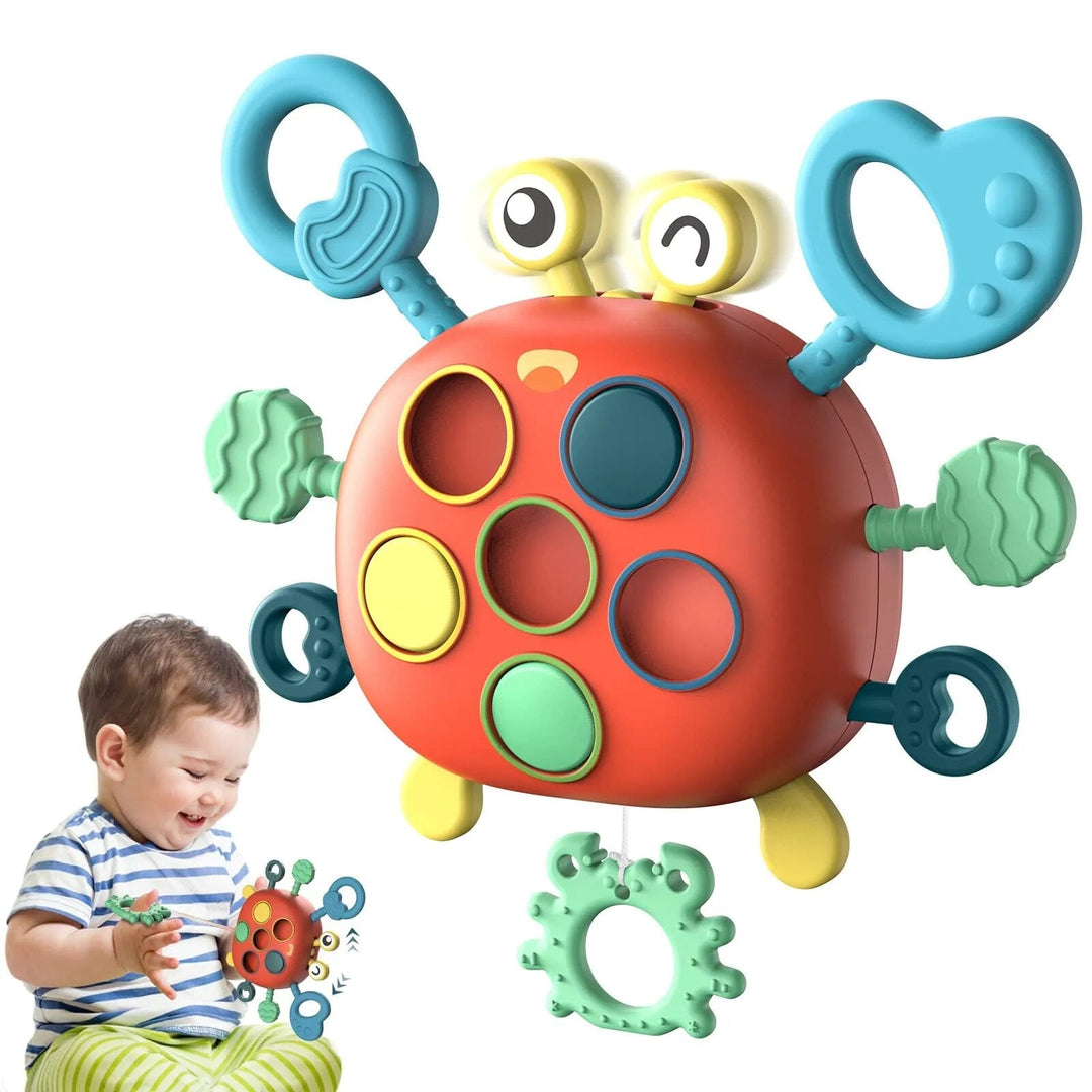 Crab-shaped sensory toy with textured rings and colored circles, shown alongside a child holding the toy