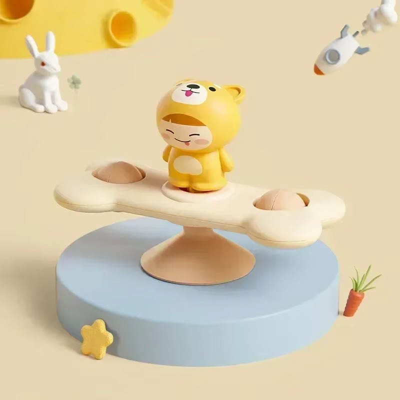 Yellow dog character on a cream bone-shaped spinner with a suction-cup base