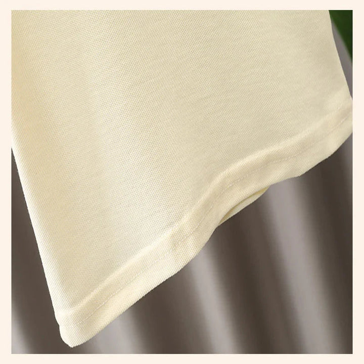 Close-up of the cream cotton polo shirt&