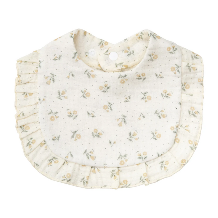 Light cream cotton baby bib with pale yellow flowers and a ruffled border