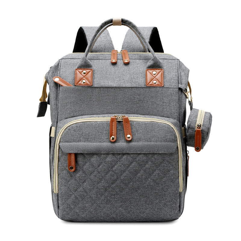 Dark gray diaper backpack with zippered front pockets and top carry handles