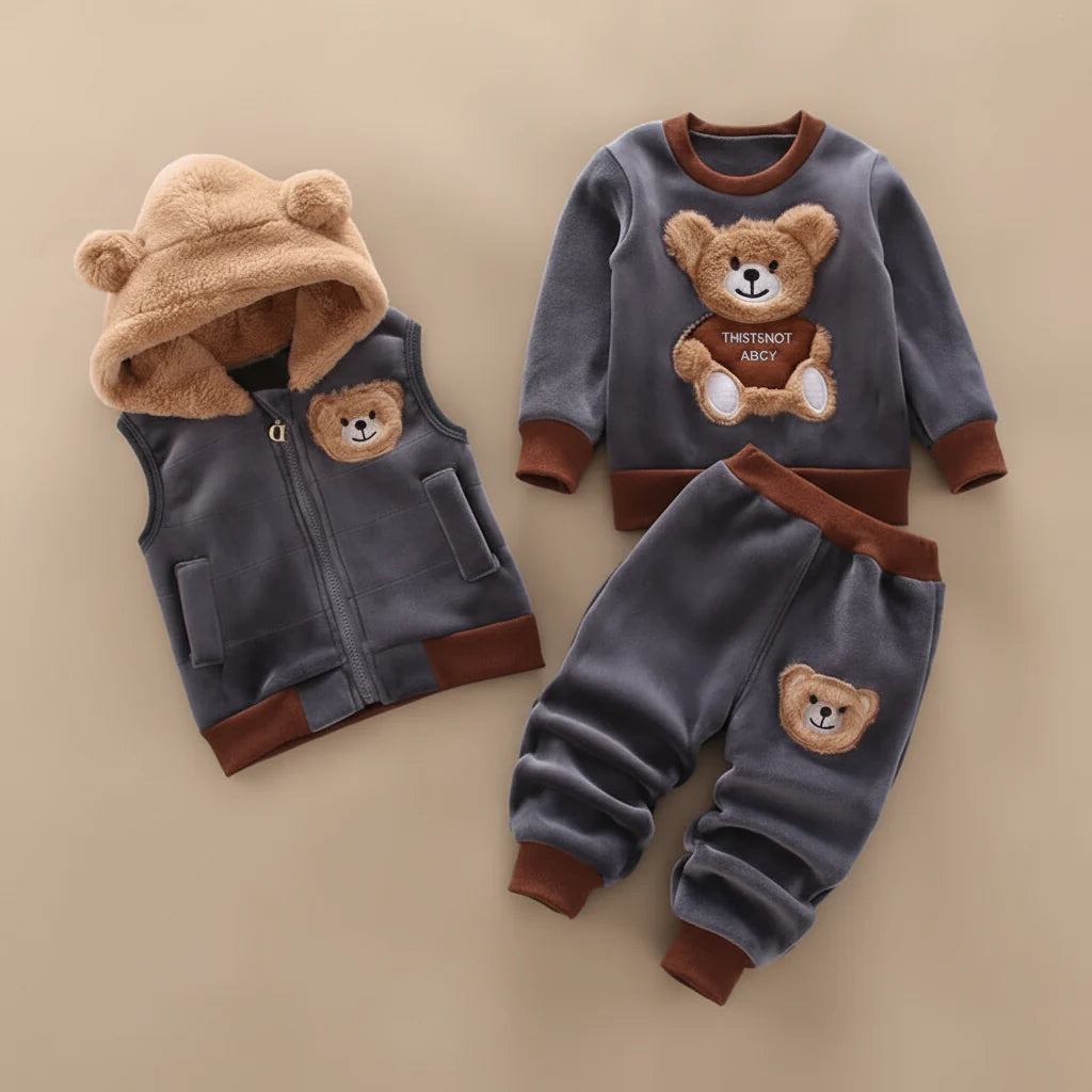 Dark gray teddy-bear pullover, matching pants, and a vest with a tan bear-ear hood