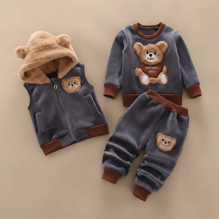 Dark gray teddy-bear pullover, matching pants, and a vest with a tan bear-ear hood