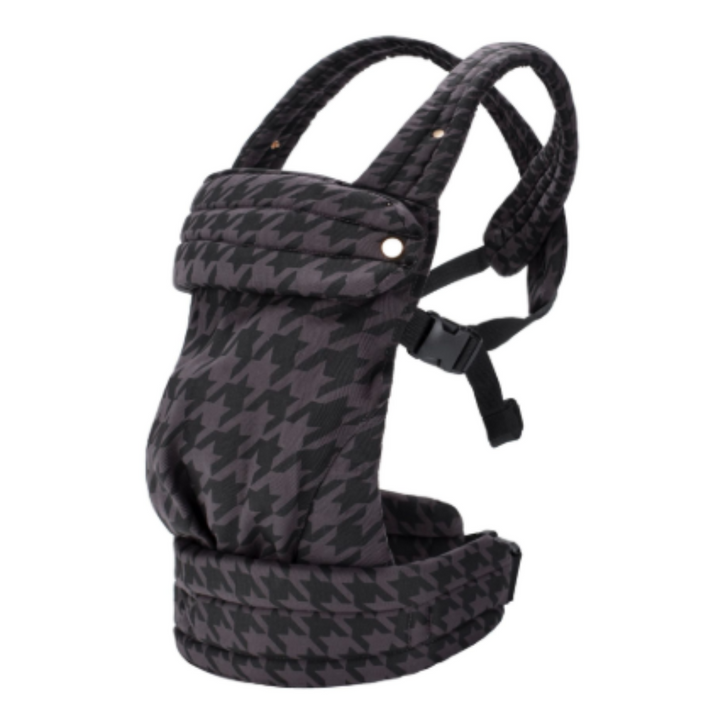 Dark houndstooth baby carrier with crossover shoulder straps and a padded waist belt