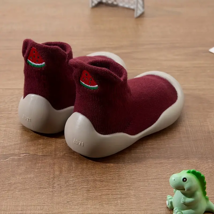 Dark red baby shoes with watermelon motifs, shown from the side and back