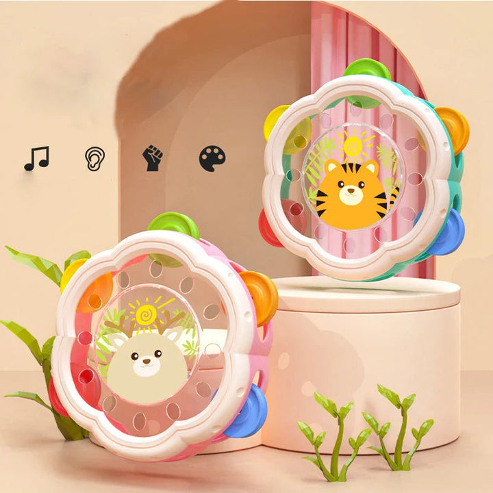 Pink deer and turquoise tiger tambourines displayed together with colorful jingles