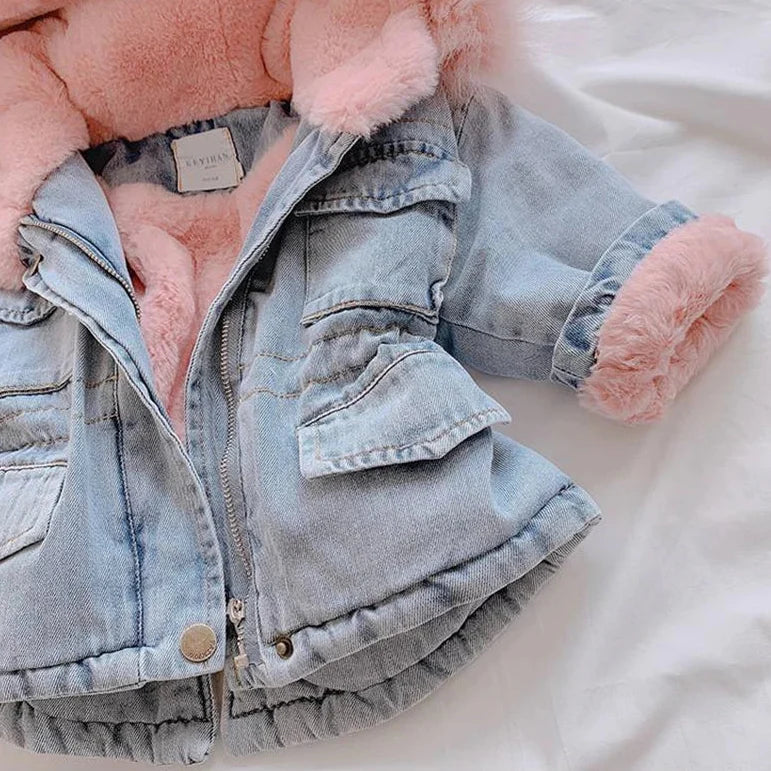 Denim-look coat showing a front flap pocket, pink-lined cuff, and curved hem