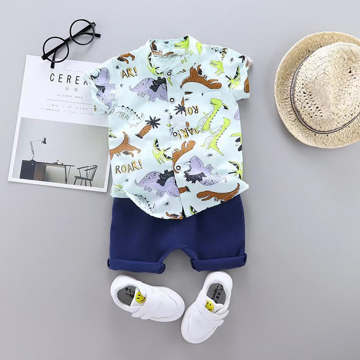Dinosaur-print short-sleeve shirt paired with navy blue cuffed shorts