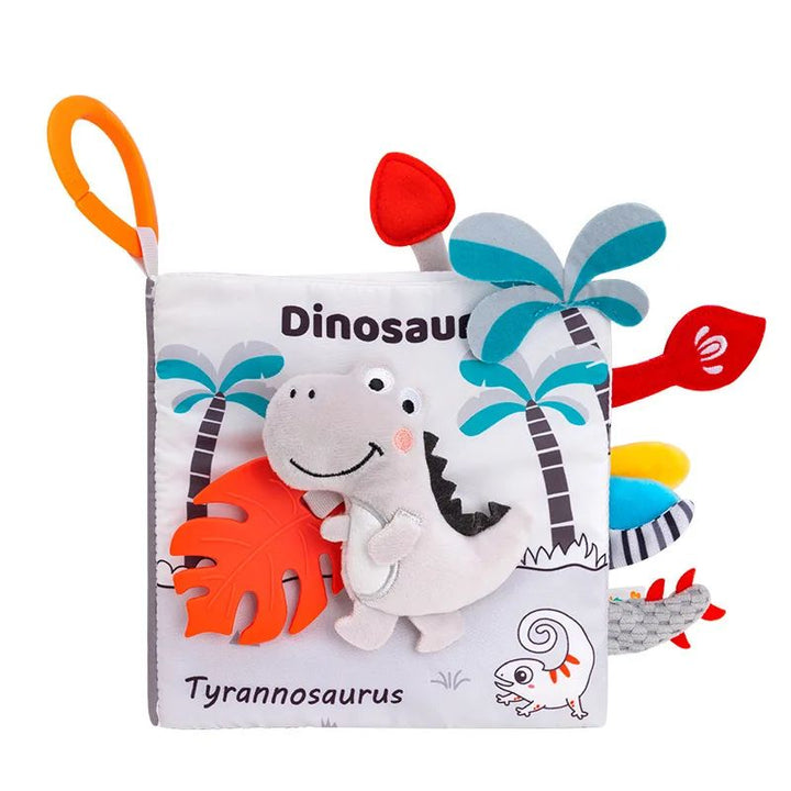 Dinosaur fabric book with a soft dinosaur on the cover, colorful tabs and an orange hanging loop