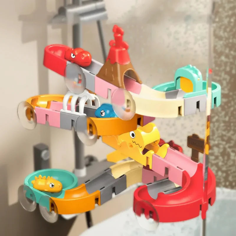 Dinosaur bath track on tile, showing curved slide sections and clear suction cups