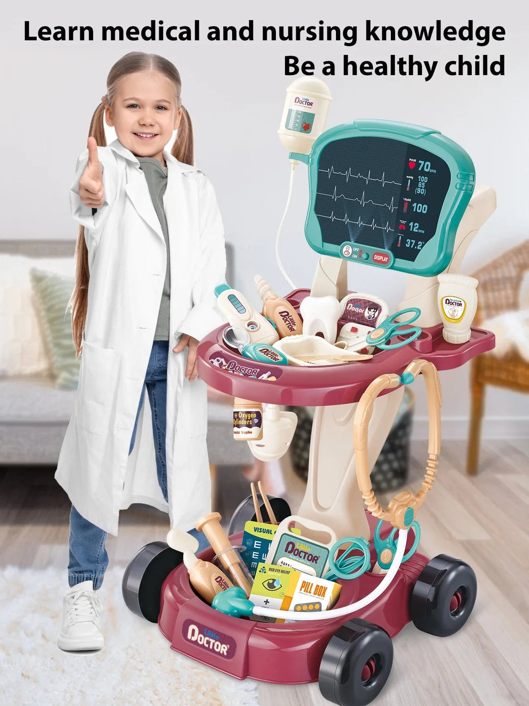 Child beside a doctor play cart filled with toy medical tools