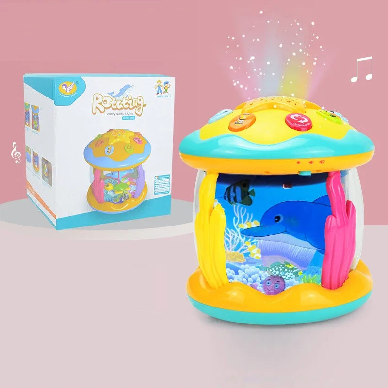 Dolphin aquarium projector toy with a yellow and turquoise top beside its retail box