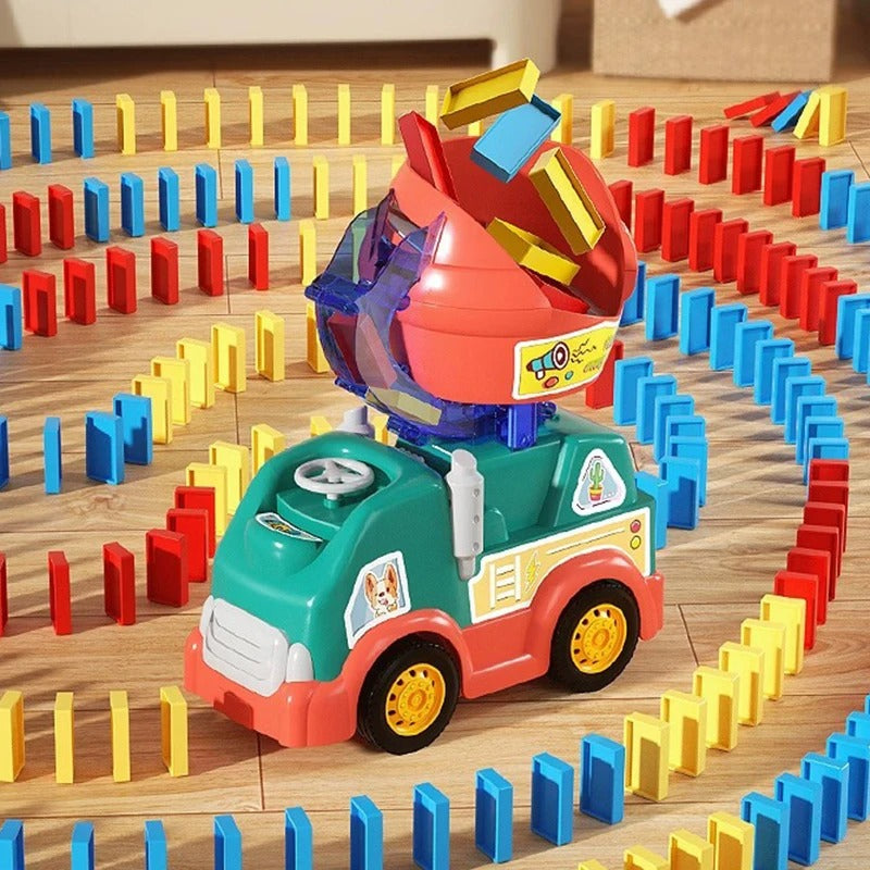 Teal and coral domino toy truck surrounded by red, blue, and yellow domino tracks