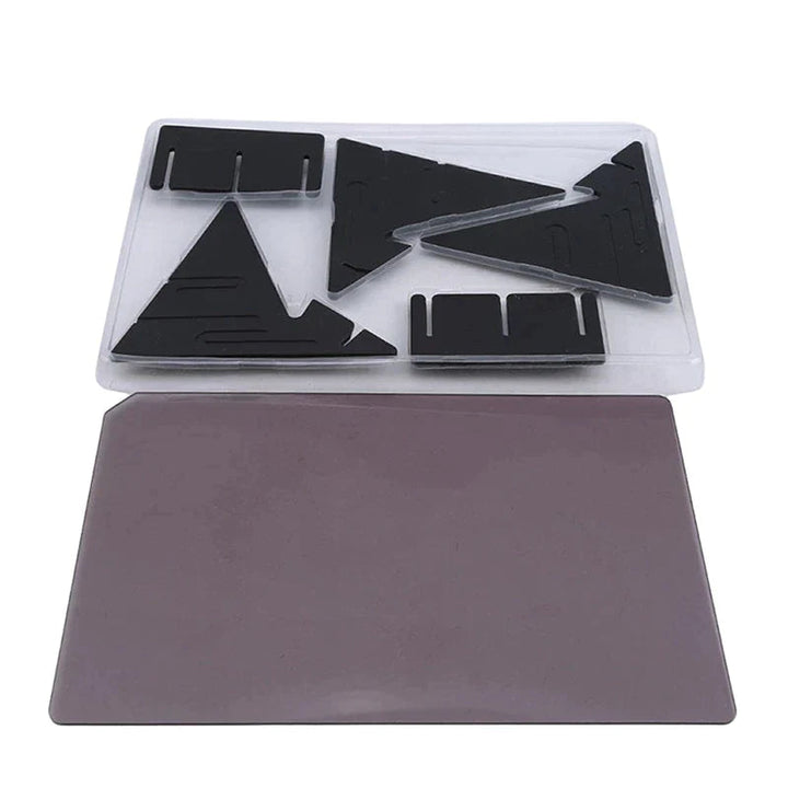 Black stand pieces in a tray beside a separate rectangular tracing panel