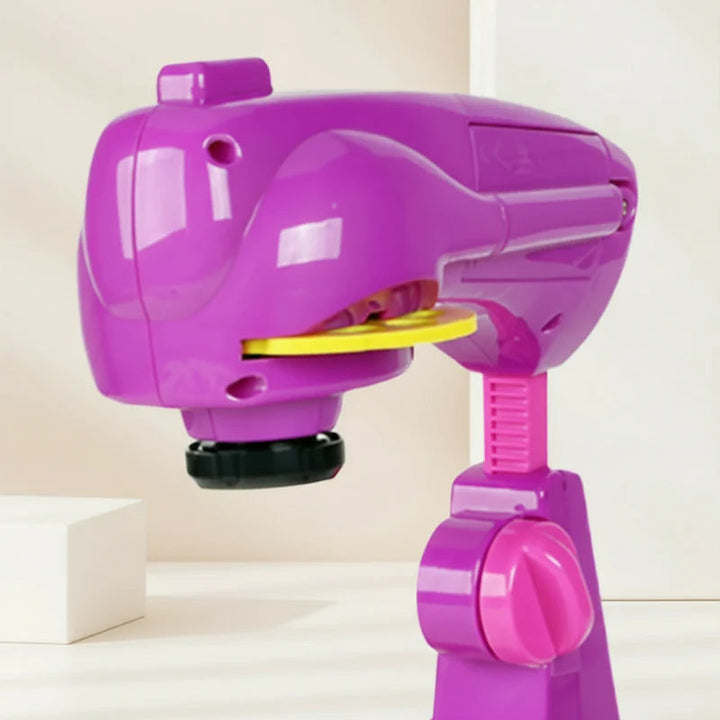 Close-up of the pink projector head, projection slide slot, and support stand.