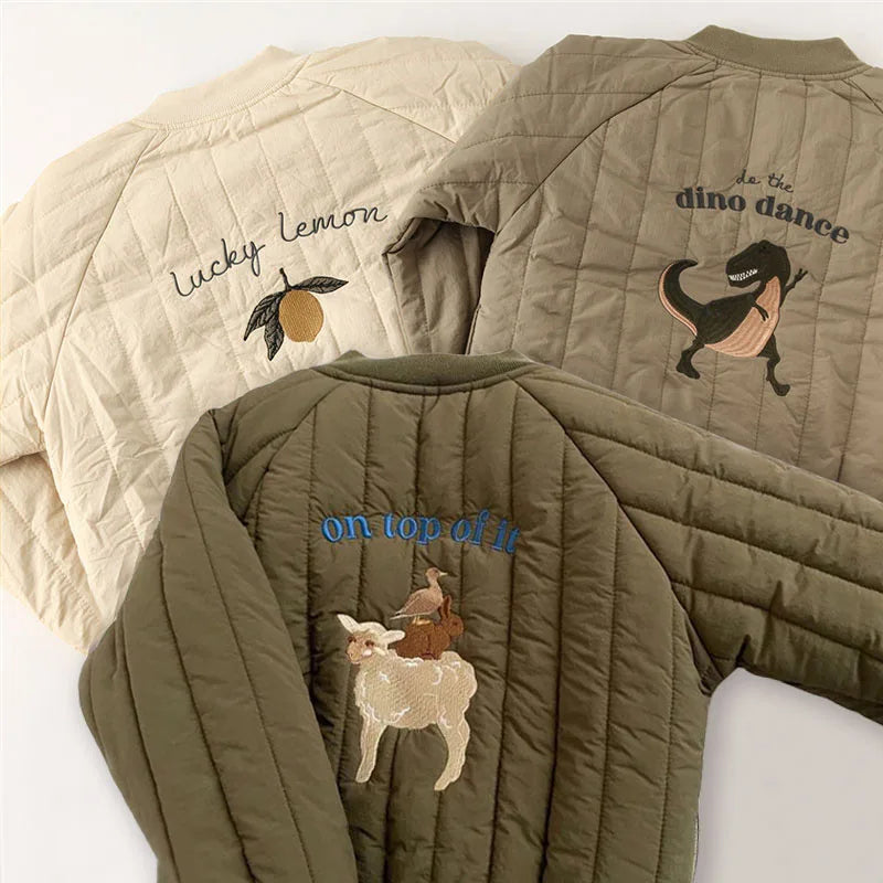 Quilted coat backs featuring lemon, dinosaur, and animal embroidery