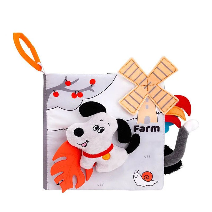 Farm fabric book with a soft cow cover, windmill illustration, fabric tabs and an orange loop