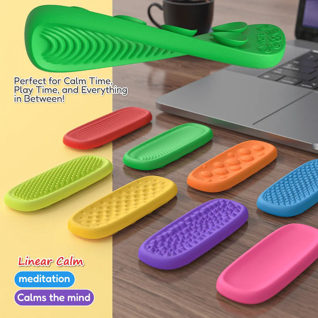 Flexible green sensory strip shown bent above assorted textured strips beside a laptop.