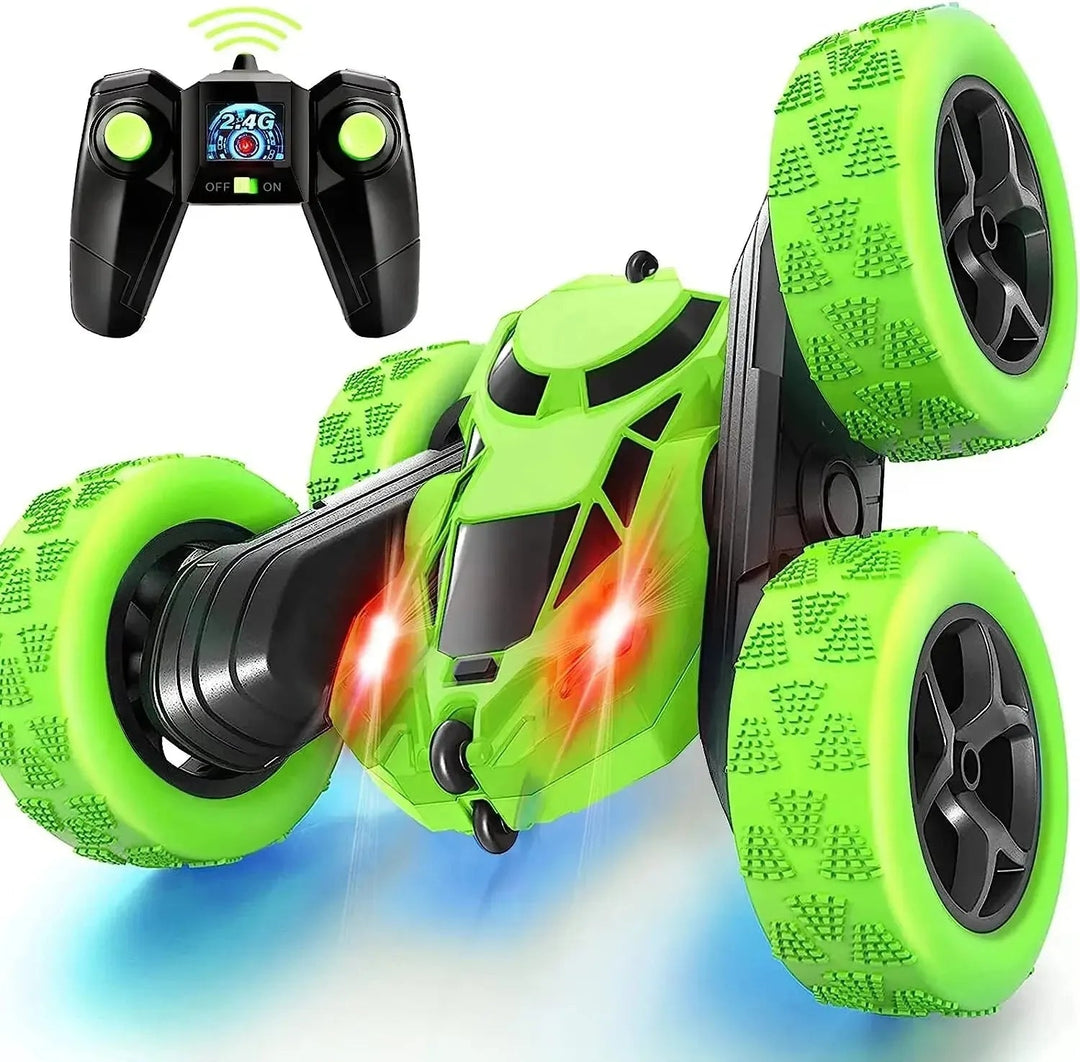 Green RC stunt car with oversized treaded wheels and a wireless remote