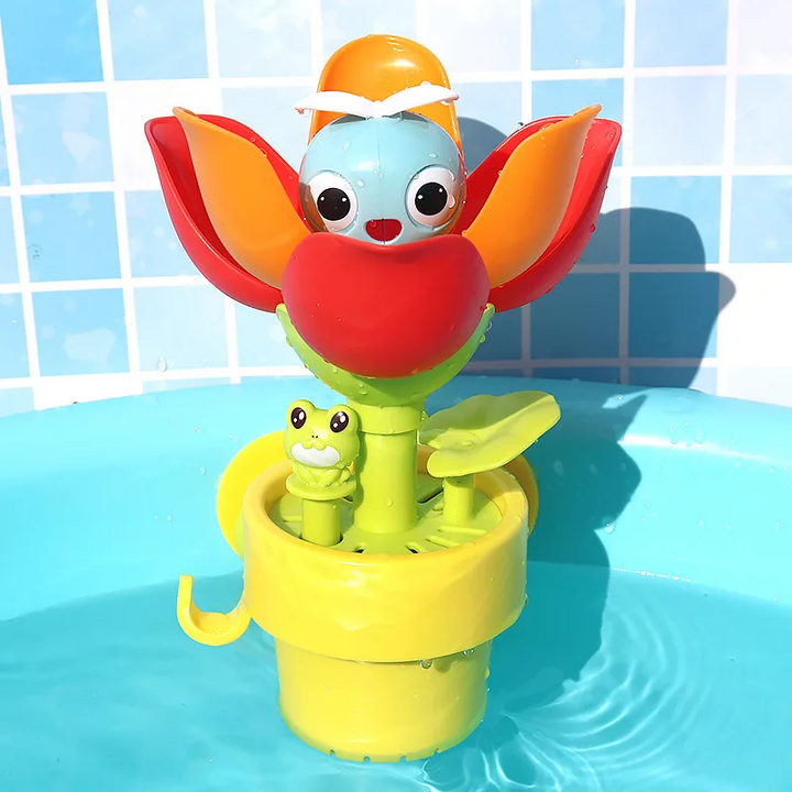 Flower bath toy with open red petals, a blue character face, and a yellow bucket